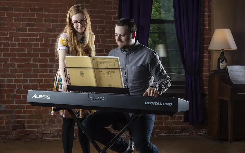 A learner receiving guided practice support at an exact Alesis Recital Pro